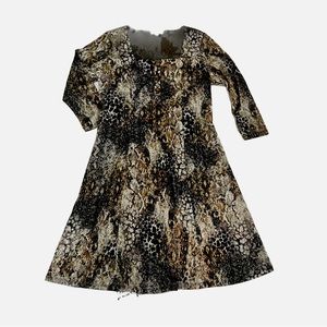 Dress by CHENNAULT . Black, brown & cream, long sleeve midi shift style. Size M